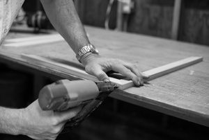 contractor using a nail gun