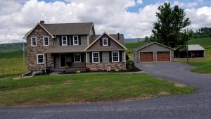 newly constructed home with a detached garage