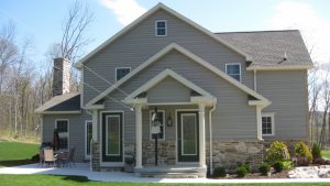 newly constructed home with pillars