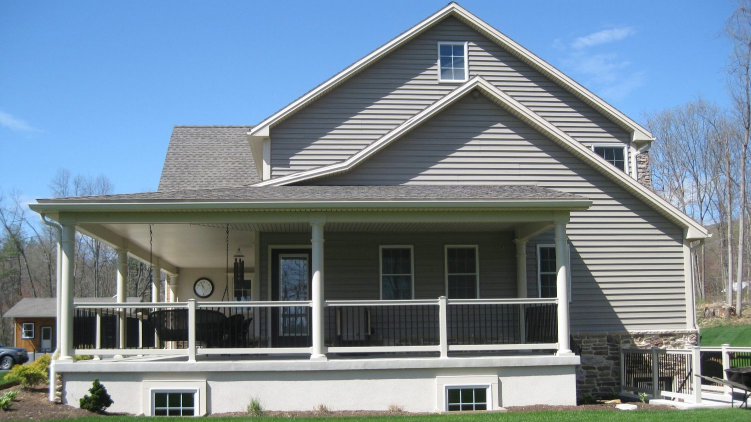 newly constructed home with wrap-around porch