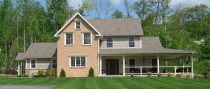 newly constructed home with a large wrap-around porch