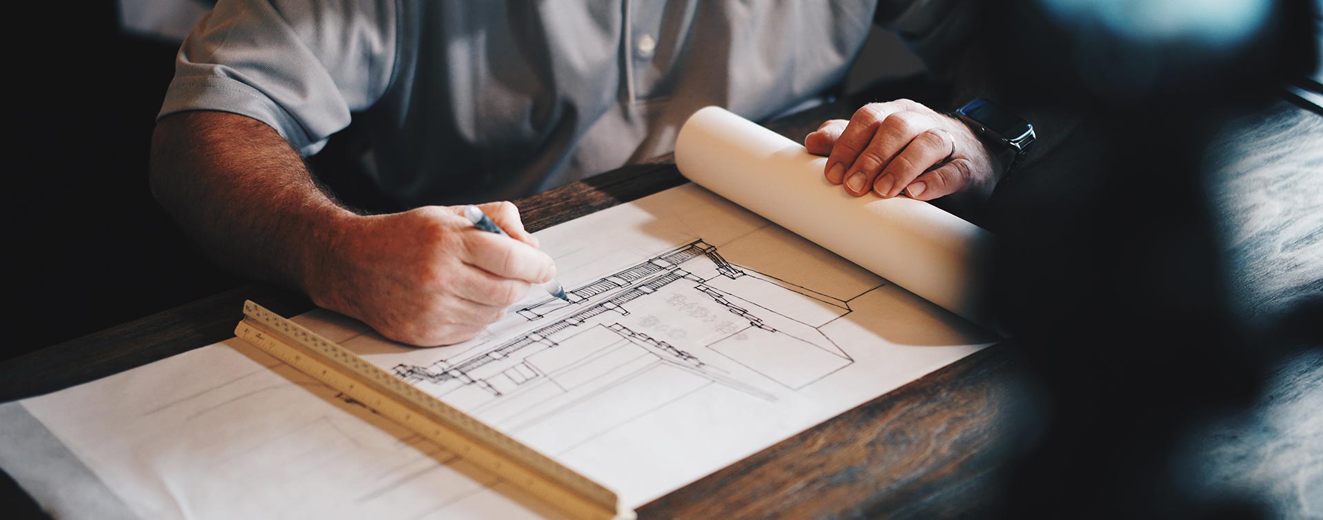 contractor drawing up building plans