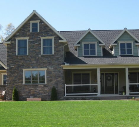 newly constructed home with a wrap-around porch