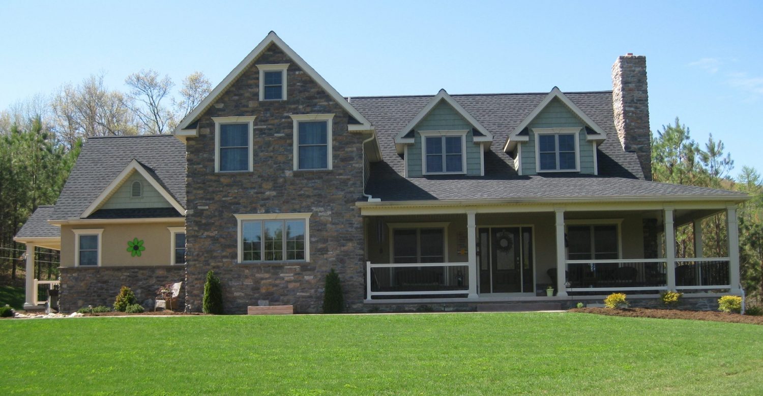 newly constructed home with a wrap-around porch