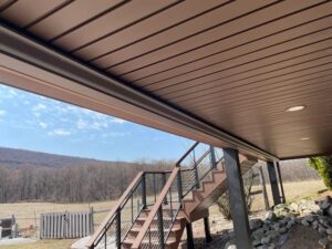 under deck with lights and stairs for a deck remodel