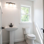 new half bathroom with toilet and sink