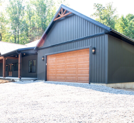 new home with a large garage and front porch