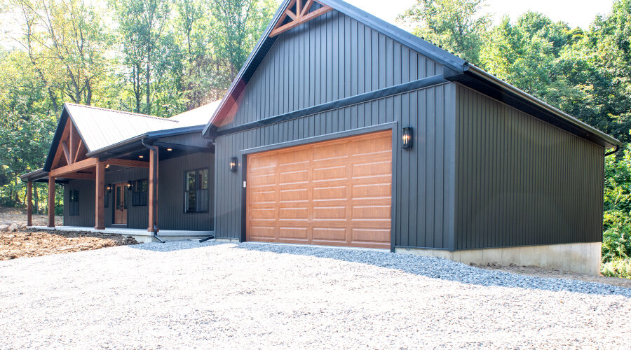 new home with a large garage and front porch
