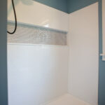 new bathroom shower with blue walls