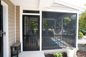 screen room addition with hammock and couches