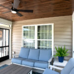 new couches and ceiling fan in screen room addition