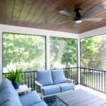 screen room addition with blue couches