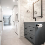 bathroom and laundry renovation with gray counters