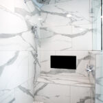 walk-in shower with marble details