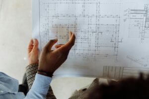 two people looking at a floor plan