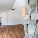 view of new living room from stone fireplace