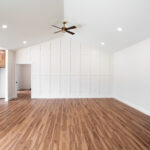 open living room with tall ceilings and wood floors