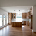 new kitchen with wooden cabinets and island