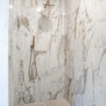 new shower with marble walls