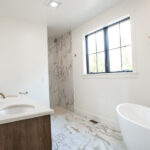 new bathroom with tub and sink