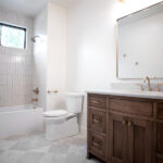 new sinks, toilet, and shower in new bathroom