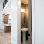 powder room off of the living room and kitchen in new home