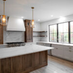 new kitchen with white counters and wooden island