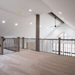large carpeted loft space in a new home