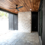 back porch with stone chimney
