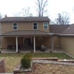 back view of a home before a siding remodel
