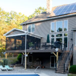 second story deck replacement with a dining area and screen room