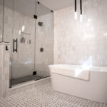 bathtub and large shower in renovated bathroom