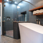 new modern bathroom with a tub and shower