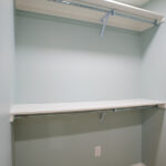 new shelves in a closet with blue walls