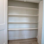 shelving in a new closet with double doors