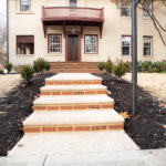 remodeled front porch with brick accents