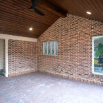 underneath a covered back patio