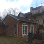 side view of a home before a patio addition