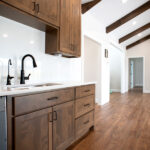 new sink in kitchen with hardwood cabinets