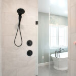 inside the walk in shower in a master bathroom