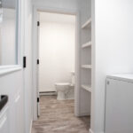 laundry room leading to a powder room