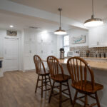 bar seating at the island of a new kitchen