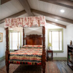 pink floral canopy bed in master bedroom addition
