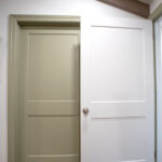green and white doors in master bedroom