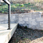 step up to a new deck connected to stone wall