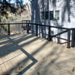 new wooden deck with black cable railings