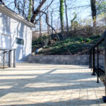 pressure-treated wood and black cable railings on new deck