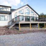 right side view of a home renovation with a new deck