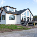 right side view of a home renovation with a new deck