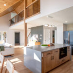 kitchen, living room, and hallway after a home renovation